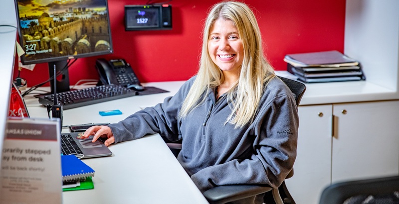 a student sitting in front of a computer